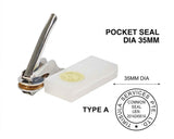 A pocket seal stamping tool with a metallic handle and a white rectangular stamp base, shown on a white background with text reading 'POCKET SEAL DIA 35MM' and a circular sample stamp.